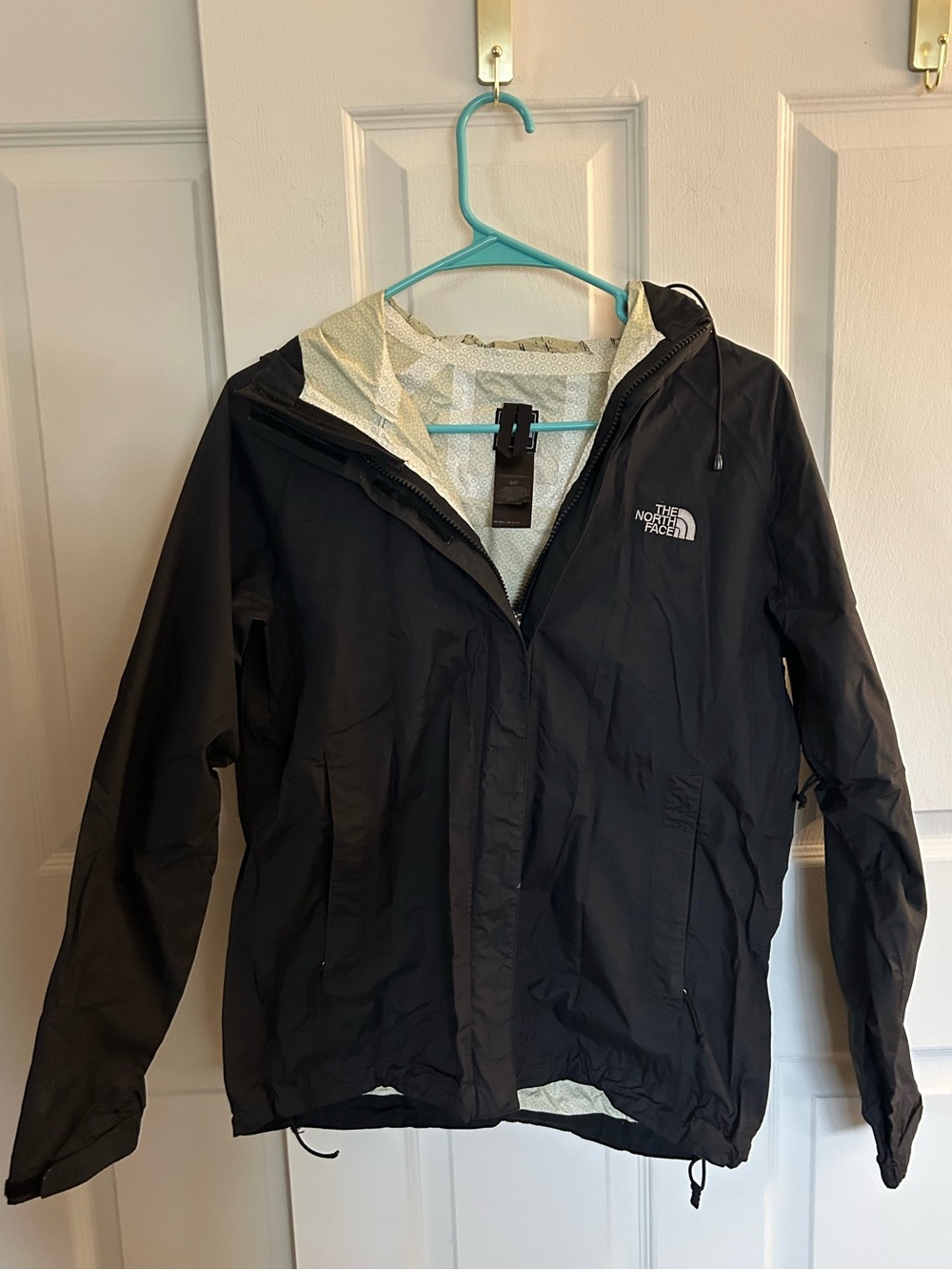 The North Face black windbreaker jacket